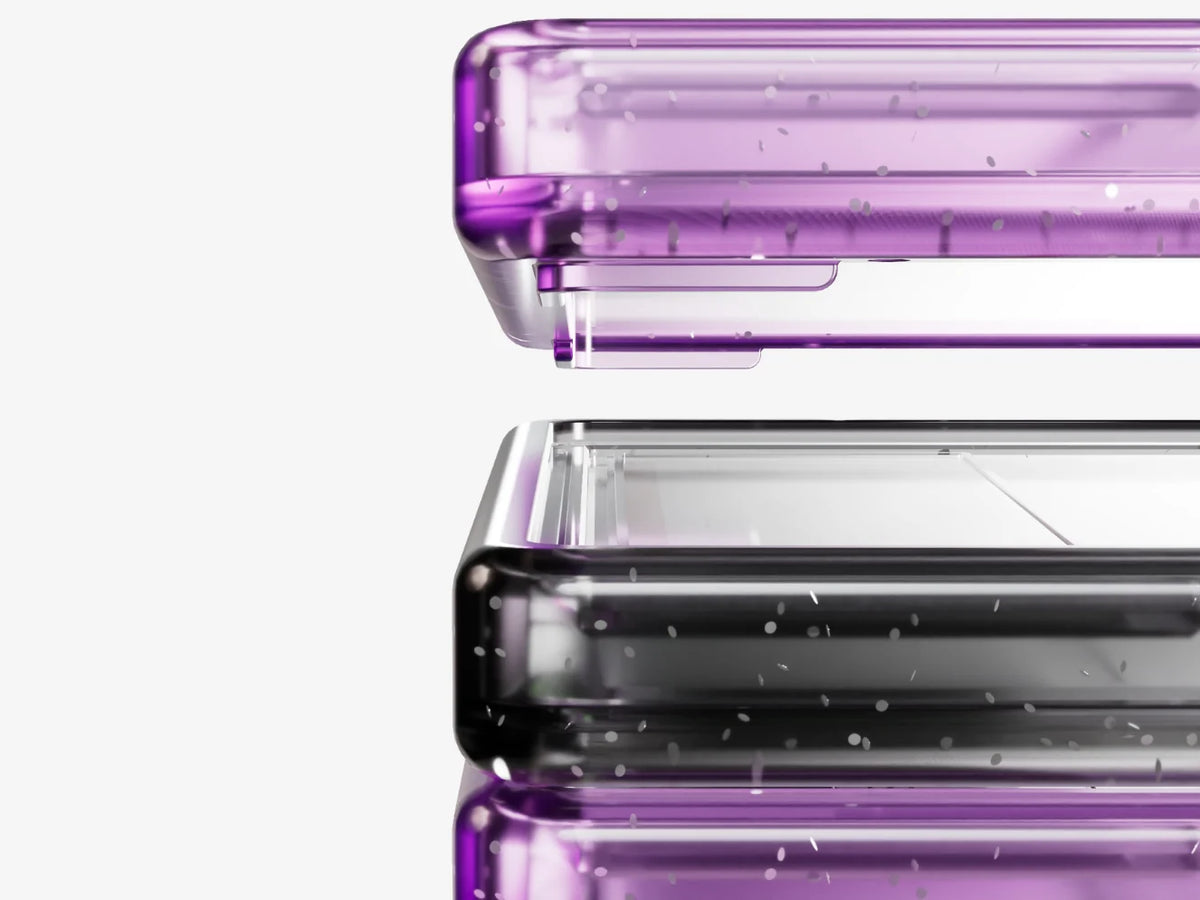 Close-up of stacked Bumpii Phantom graded card guard frames showing translucent purple and black corner details.